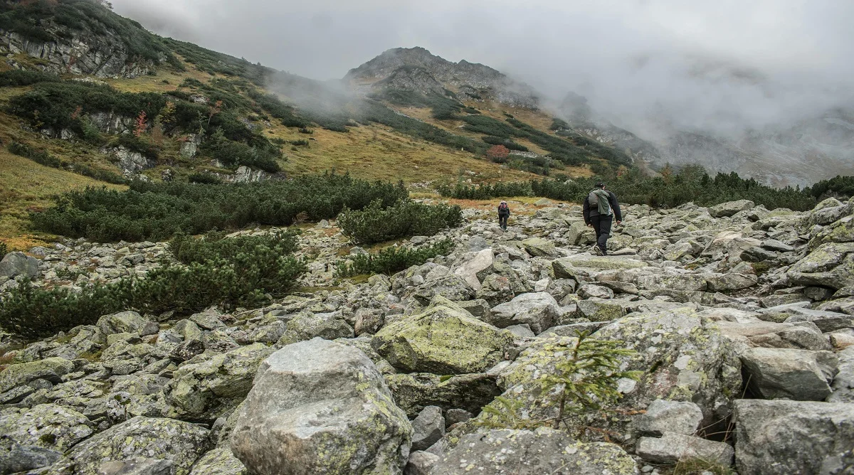 rocky trail sections require careful hiking foot placement on uneven rocks