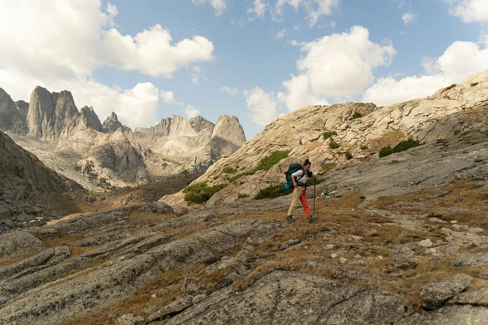 cool wind after a climb is easier to manage when hikers add a light layer quickly