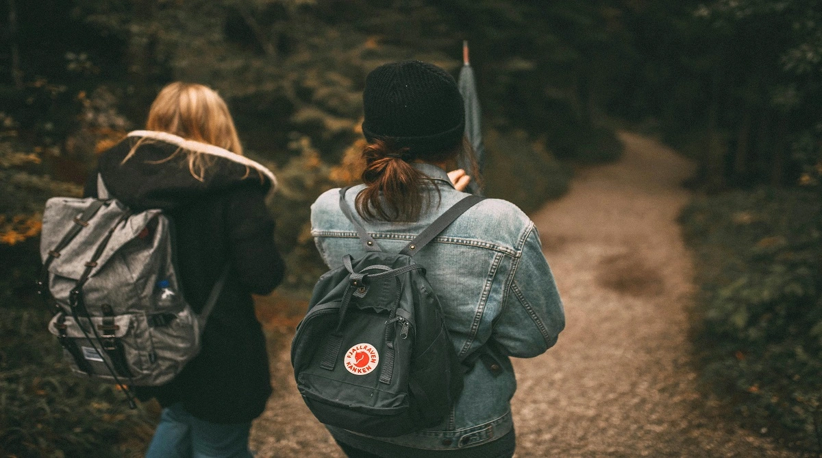 staying aware on a hiking trail while walking through a forest path