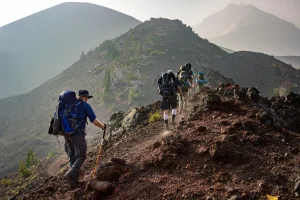 hikers feel more tired after descents when uneven footing increases braking and balance work