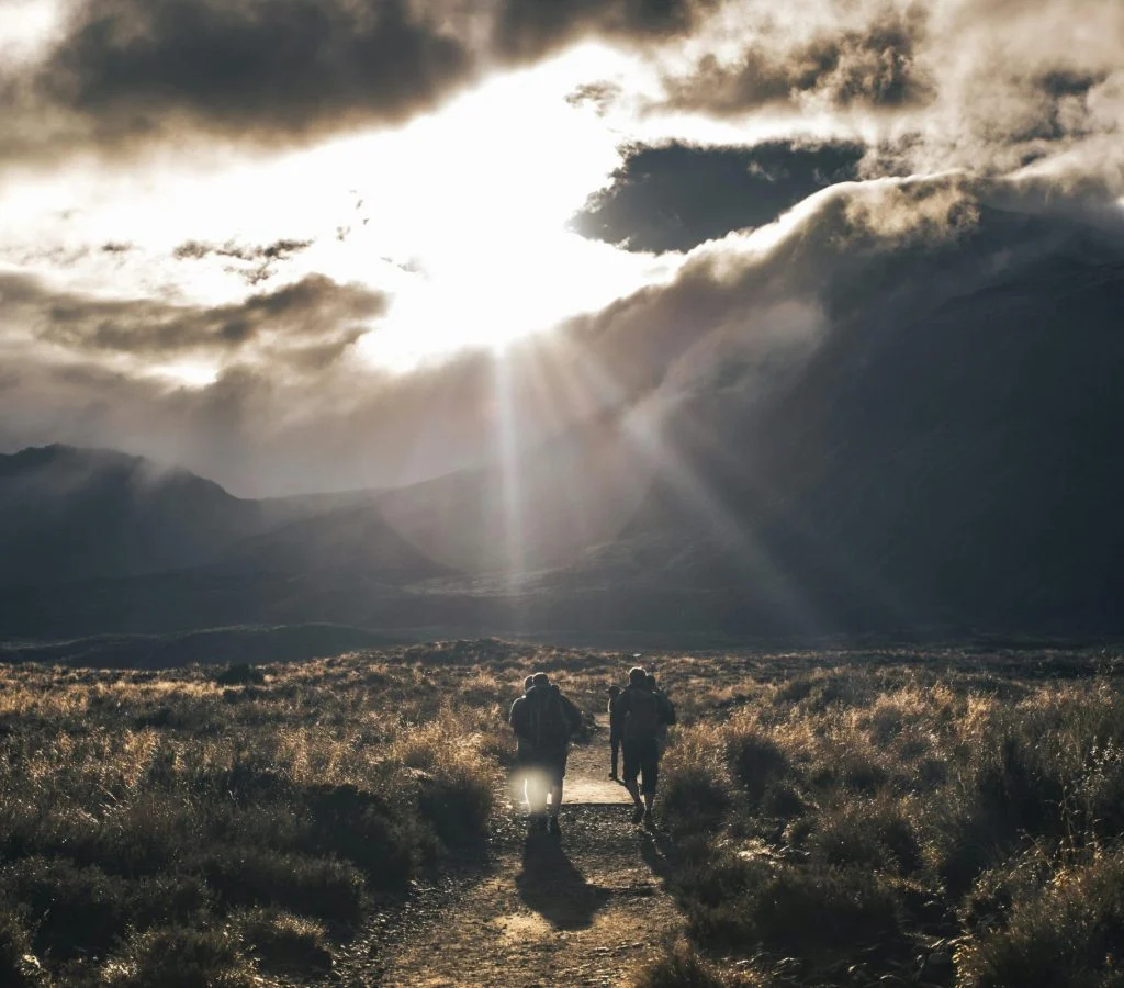 Hiker moving from shade to sunlight
