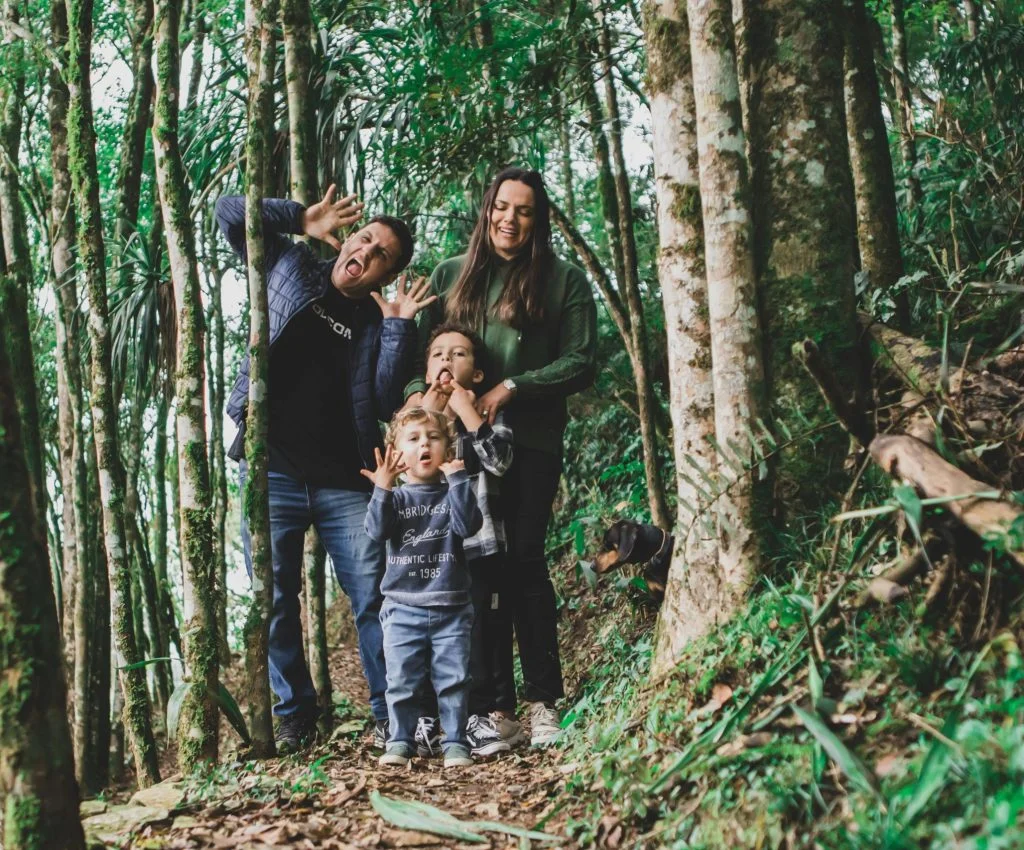 Children playing and resting during a family hike in nature