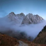 Hiker in mountains experiencing temperature change
