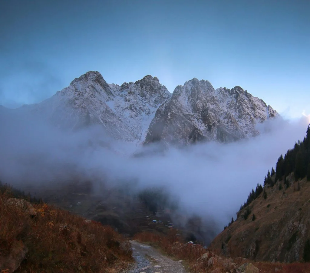 Hiker in mountains experiencing temperature change