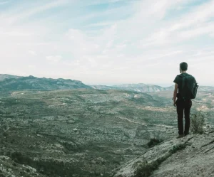 A hiker checking their watch during a solo hike