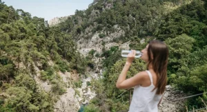 hiker drinking water outdoors