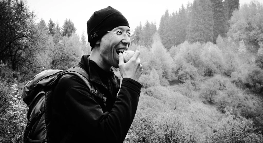 hiker eating snack on trail