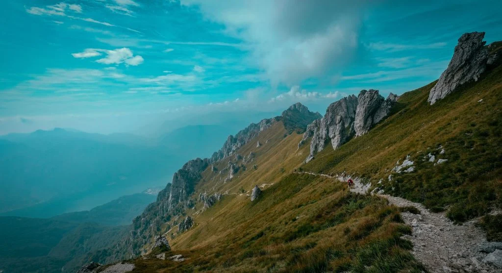 Open ridge trails often feel more tiring than sheltered forest paths on the same hike
