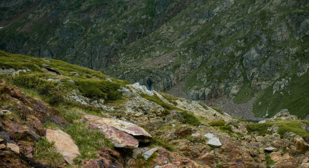hiker taking break on mountain trail