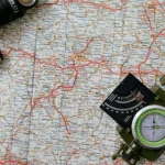 hiker checking map on trail