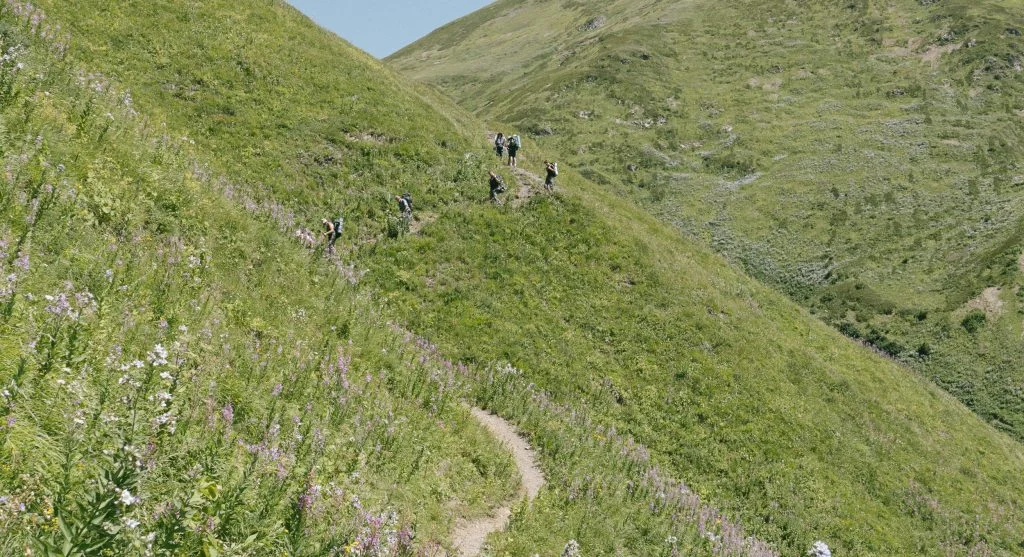 Trail that starts flat feels easier when hikers pace for the harder later sections