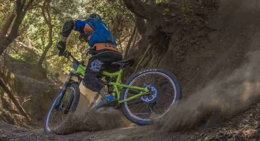 Loose dust on a downhill trail reduces traction and control
